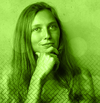 A young woman with her hand on her chin, thinking.