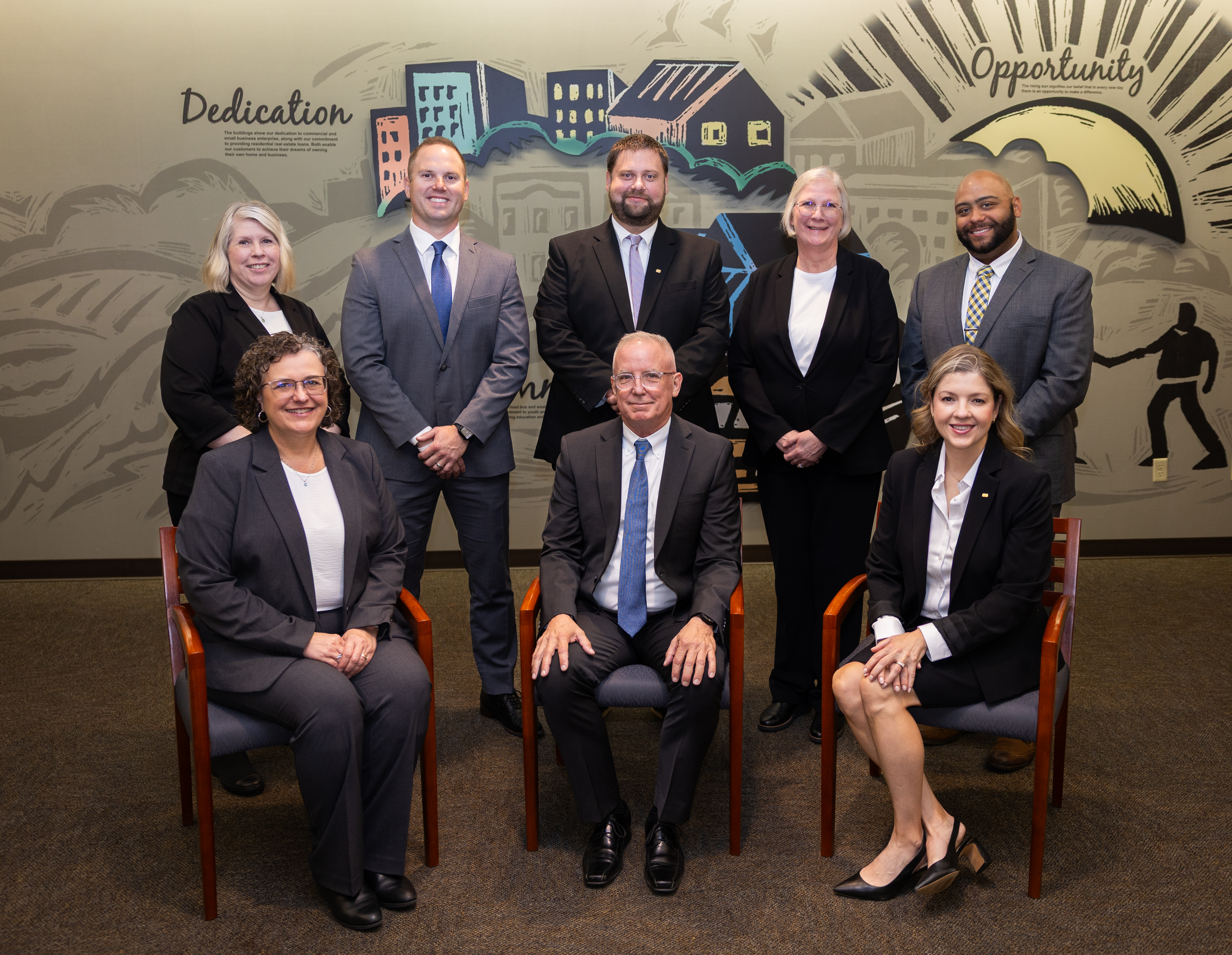 Team photo of eight Retirement Plan Services employees.