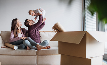 couple with baby in new house