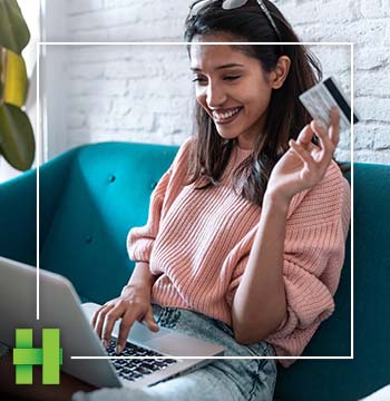 Woman shopping online with her card