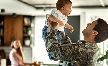 veteran holding child