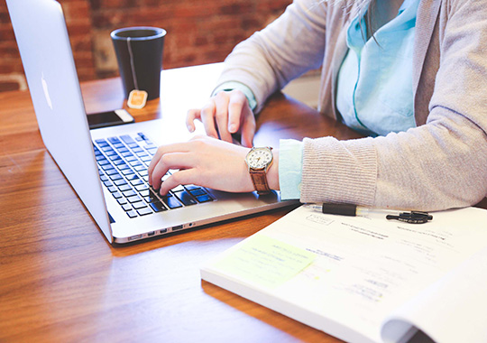 Person using laptop on desk